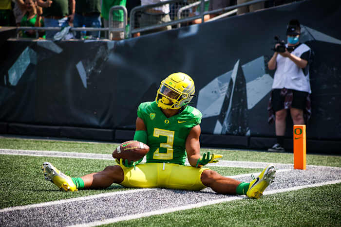 Johnson celebrates a touchdown against Fresno State in week 1 at Autzen Stadium.